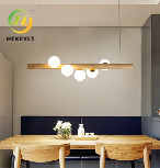 مصباح مطعم النمط الشمالي الخشبي الصلب بسيط حديث LED بار إبداعي ثريا